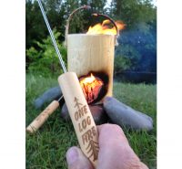ONE LOG FIRE ROASTING STICK IN HAND