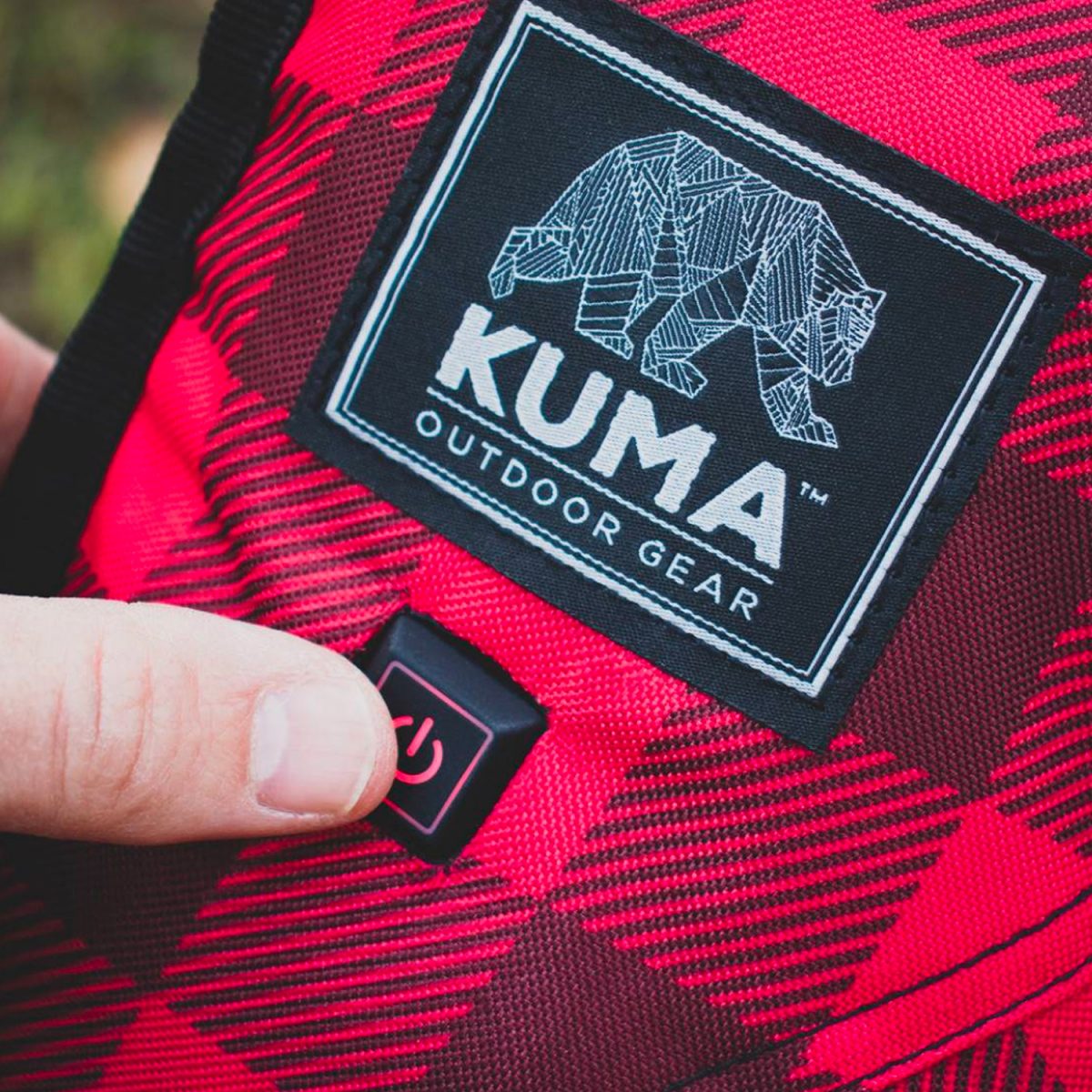kuma heated. lazy bear chair button closeup