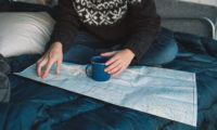 A cup of coffee sitting on a map