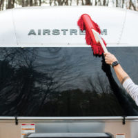 Shell of an Airstream being cleaned with a California Car Duster
