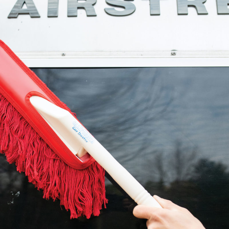California Car Duster Cleaning off the outside of an Airstream